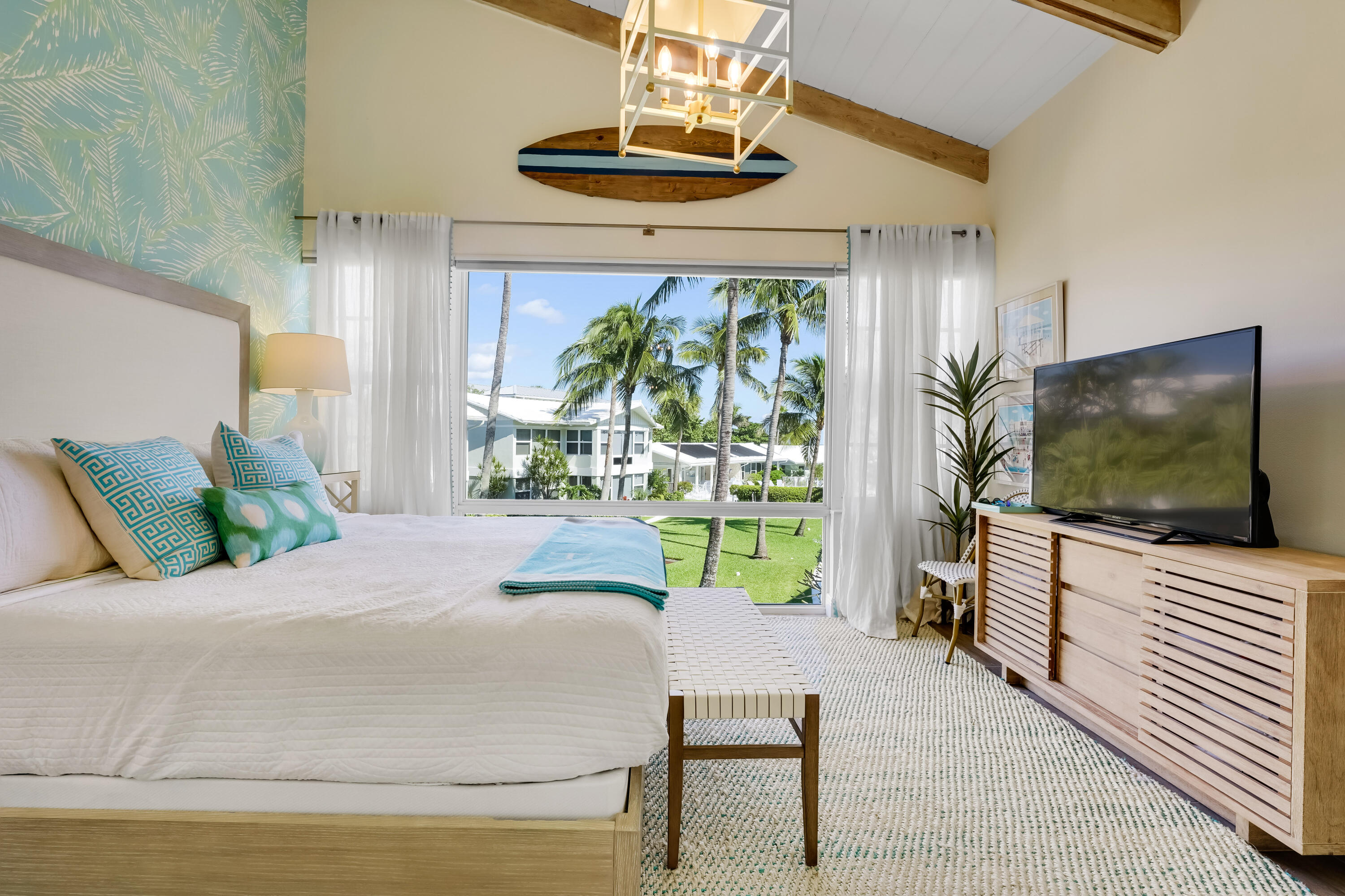 320 South Ocean Boulevard, Unit UK Delray Beach, FL 33483 - Photo 12 of 27 a bedroom with a bed and a flat screen tv