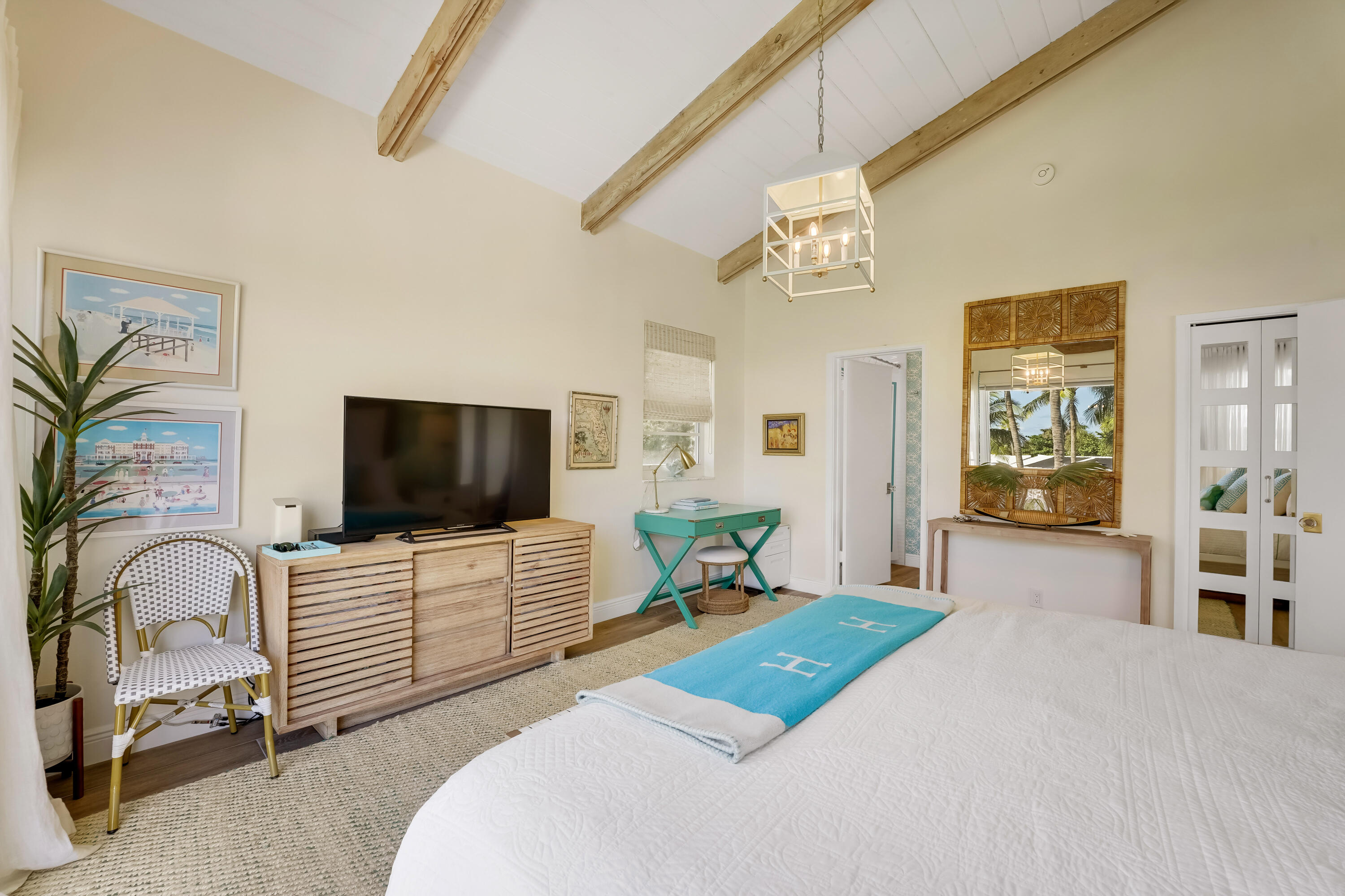 320 South Ocean Boulevard, Unit UK Delray Beach, FL 33483 - Photo 13 of 27 a bedroom with furniture and a flat screen tv