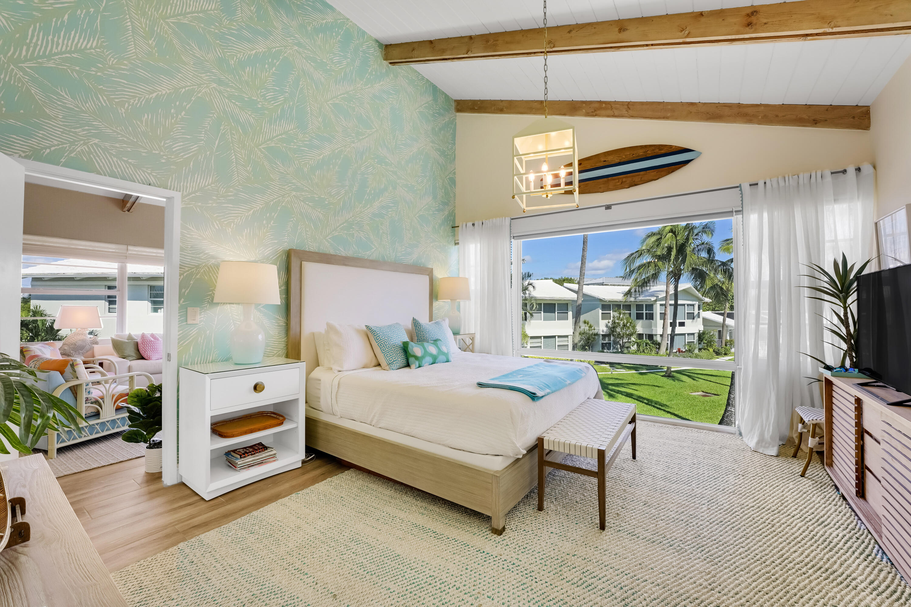 320 South Ocean Boulevard, Unit UK Delray Beach, FL 33483 - Photo 15 of 27 a bedroom with a bed and a flat tv screen next to a window