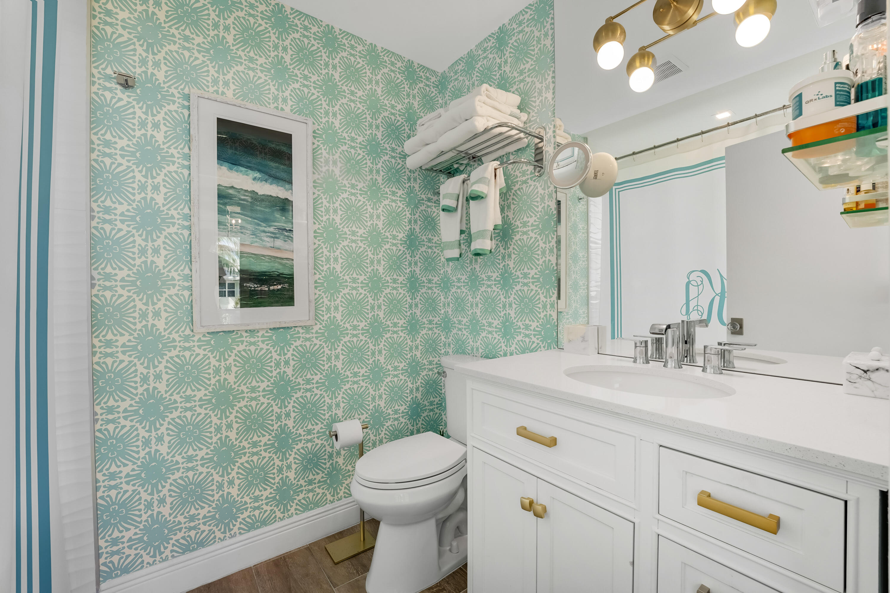 320 South Ocean Boulevard, Unit UK Delray Beach, FL 33483 - Photo 16 of 27 a bathroom with a sink vanity mirror and toilet