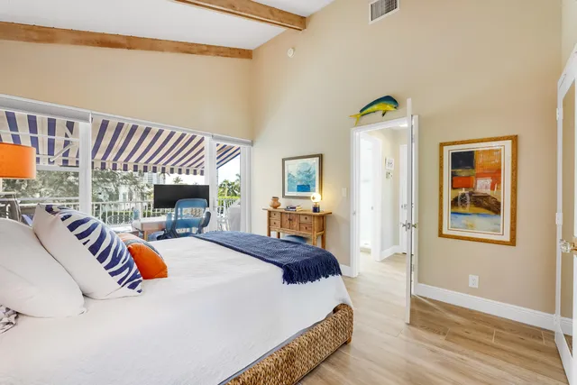 a bed room with a bed and a chair