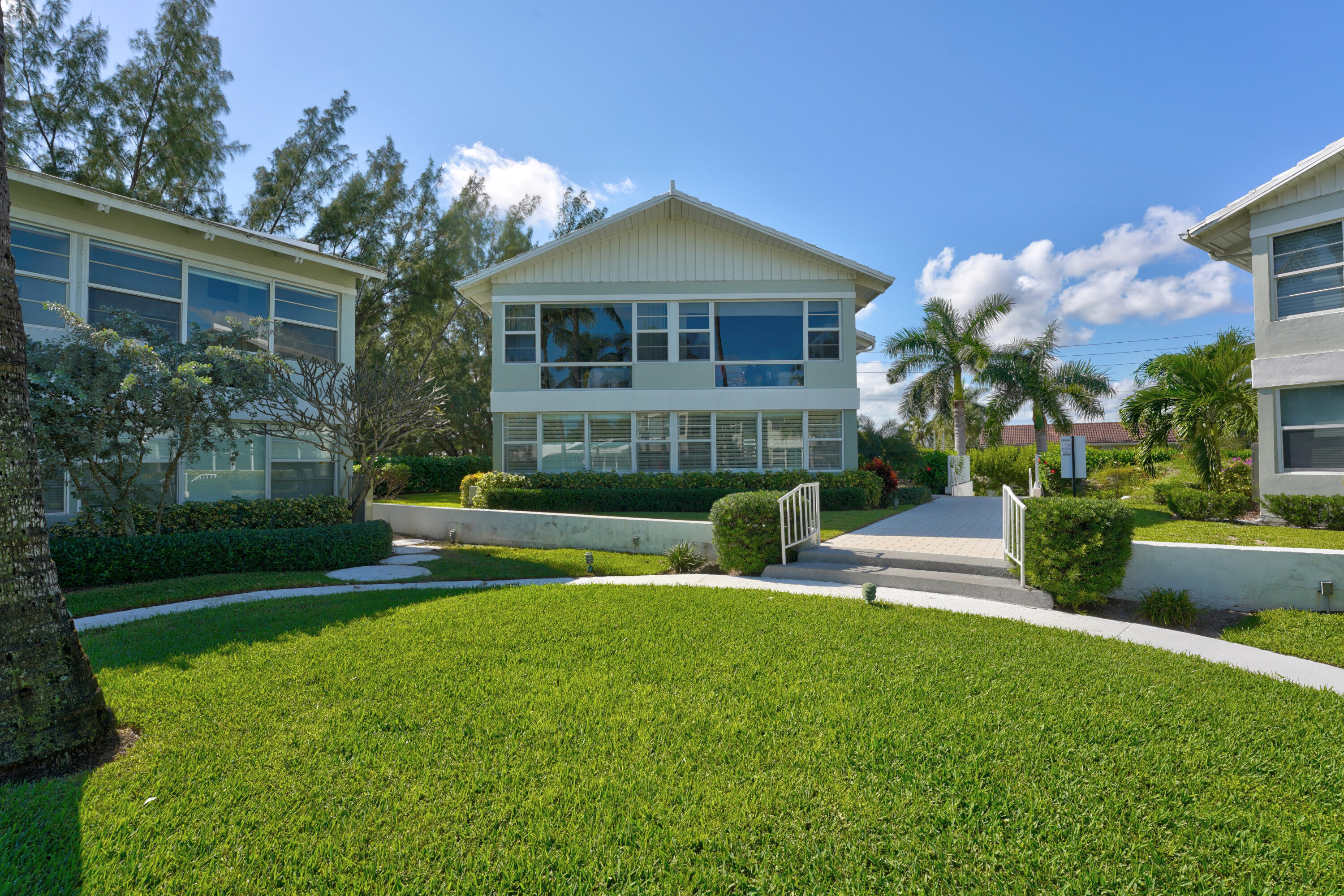 320 South Ocean Boulevard, Unit UK Delray Beach, FL 33483 - Photo 21 of 27 a view of a house with a yard porch and sitting area
