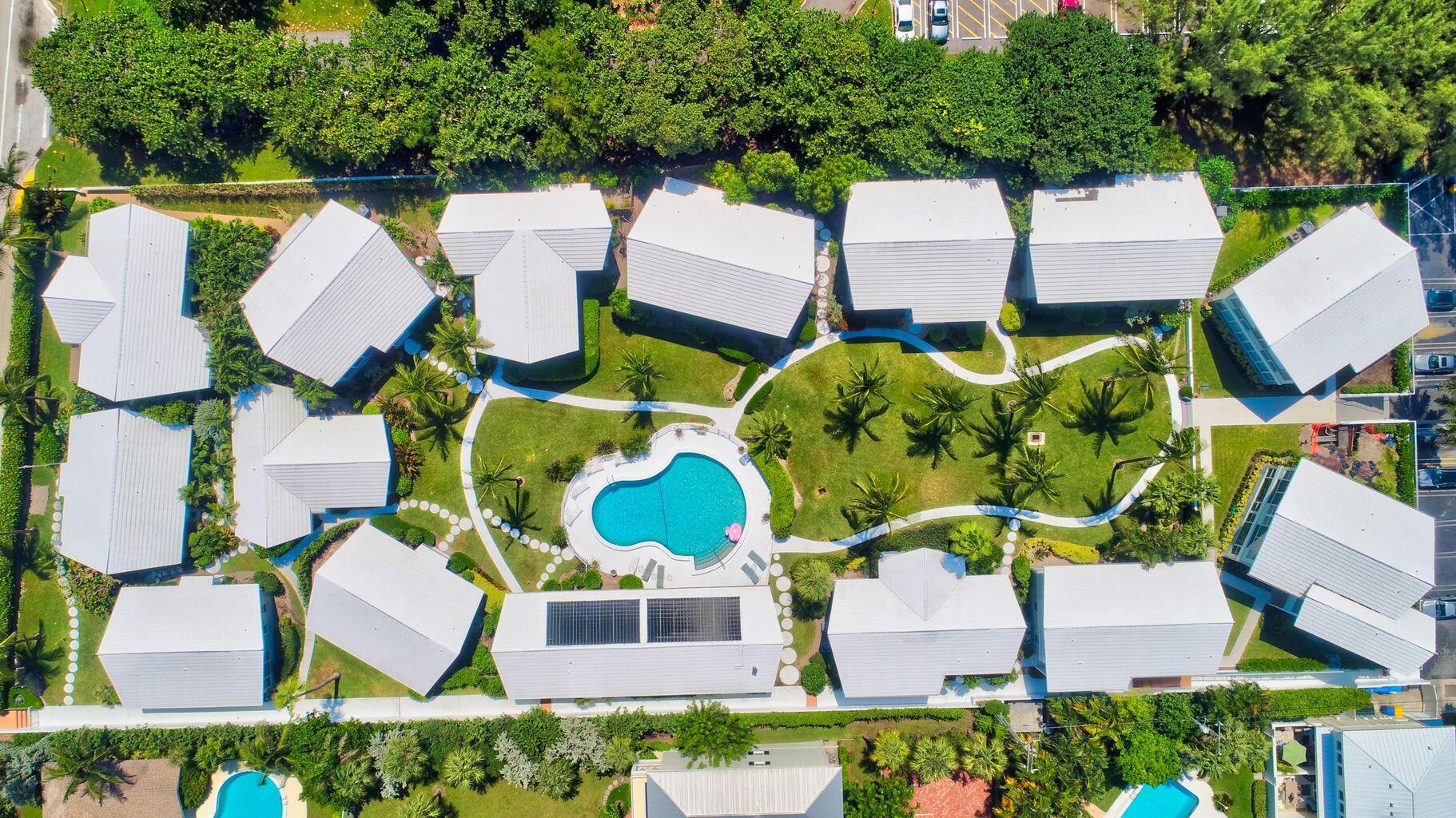 320 South Ocean Boulevard, Unit UK Delray Beach, FL 33483 - Photo 22 of 27 an aerial view of a house with swimming pool and outdoor seating