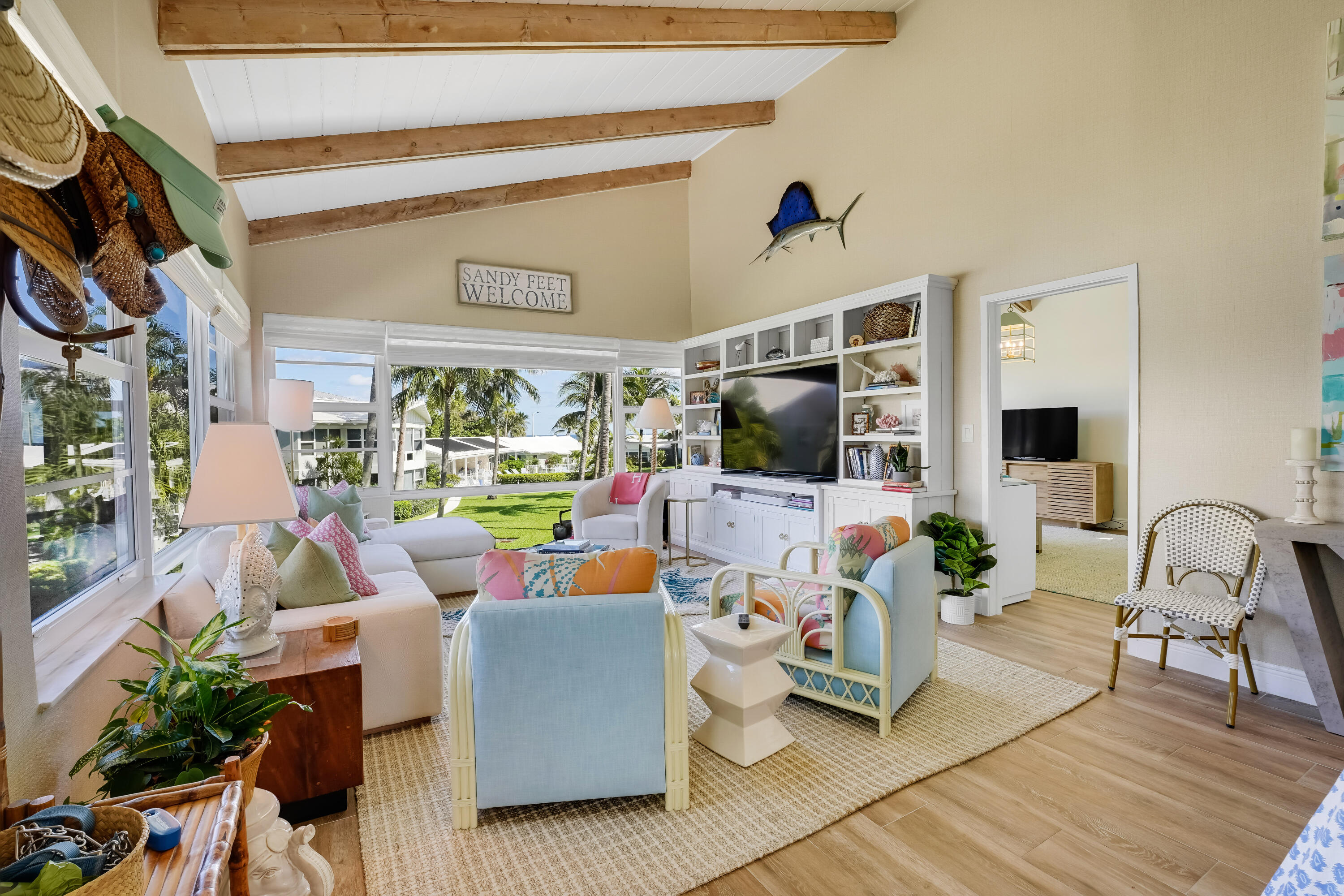 320 South Ocean Boulevard, Unit UK Delray Beach, FL 33483 - Photo 6 of 27 a living room with furniture and a flat screen tv