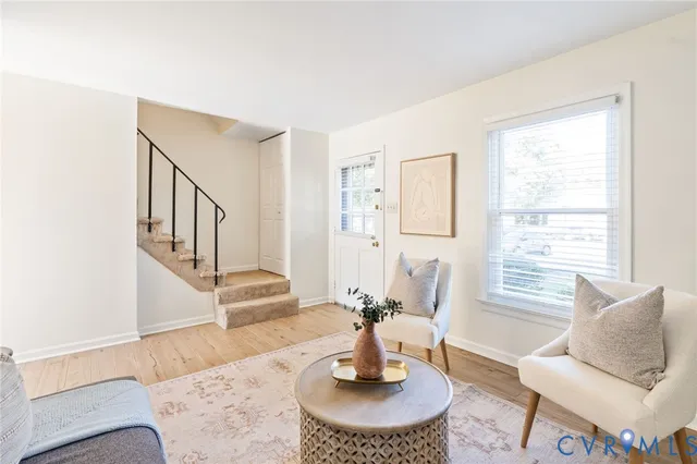 a living room with furniture and a table