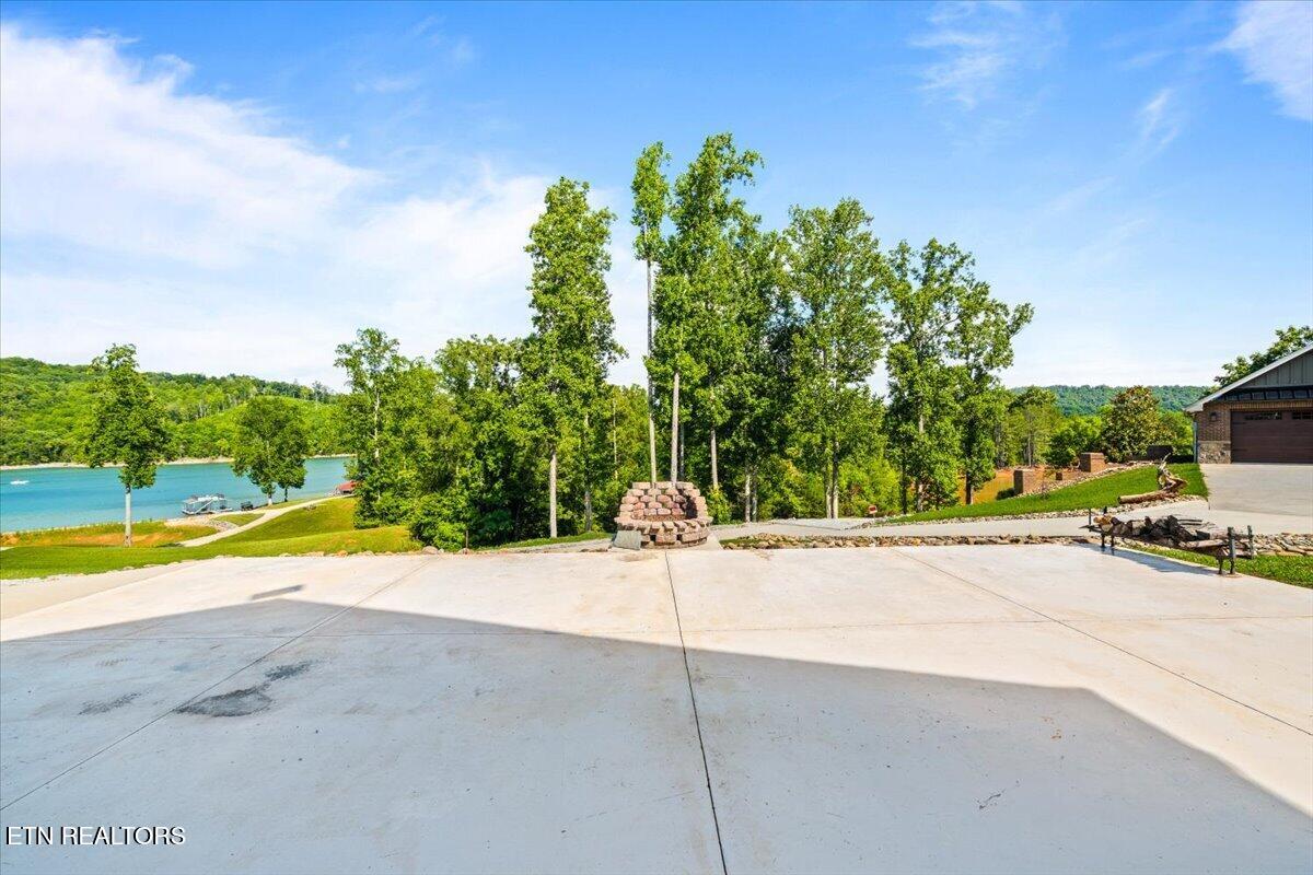 1380 East Norris Point Road La Follette, TN 37766 - Photo 51 of 54 Back Concrete Patio with Firepit