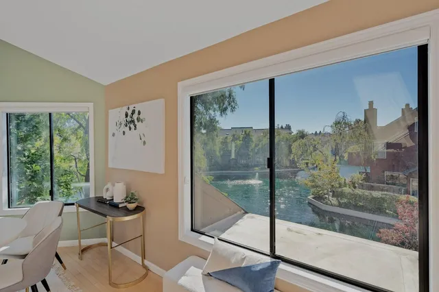 a living room with patio furniture and a fireplace