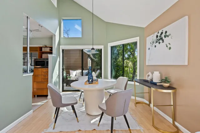 a kitchen with stainless steel appliances granite countertop a sink a stove and a refrigerator