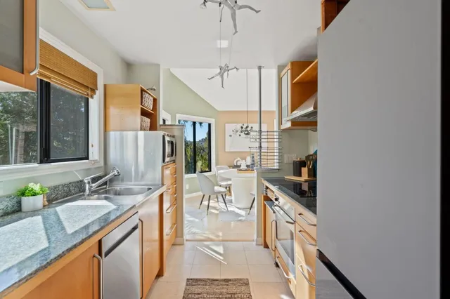 a bathroom with a tub shower and toilet