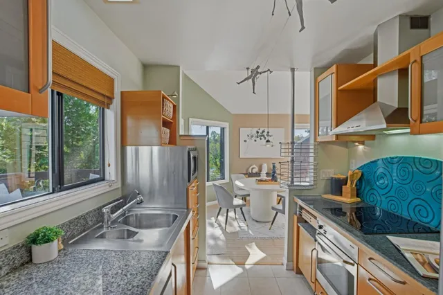 a bedroom with a large bed and a large window