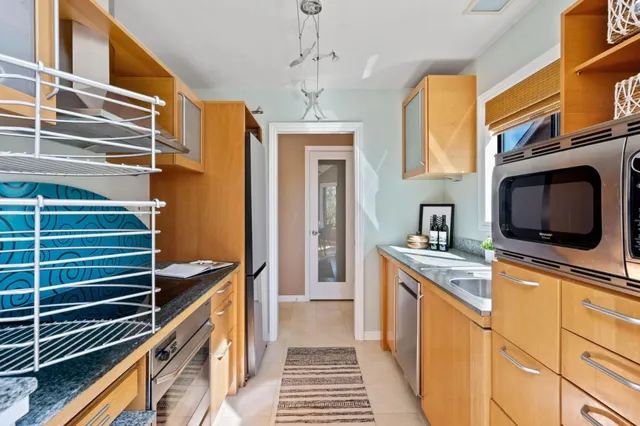 a living room with a bed furniture and a table