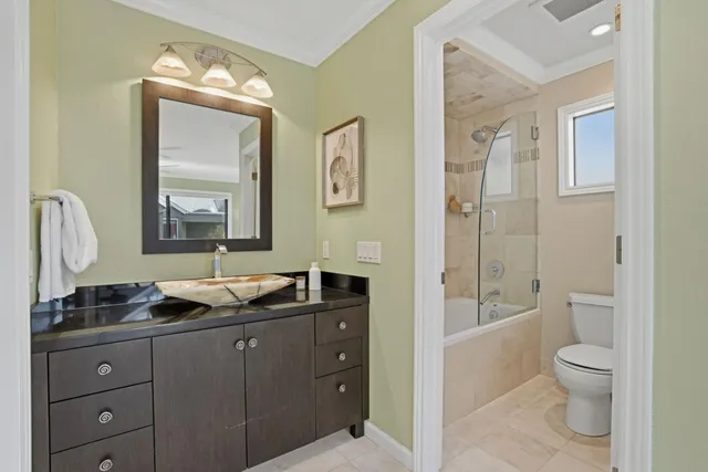 a bathroom with a bathtub and mirror