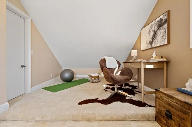 a view of a chair and table in the balcony