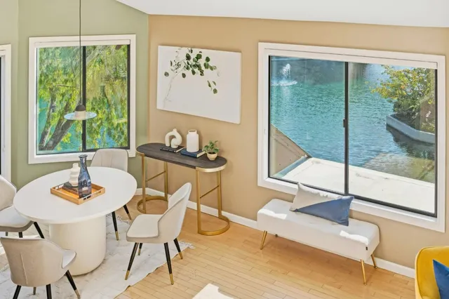 a view of a dining room with furniture window and outside view