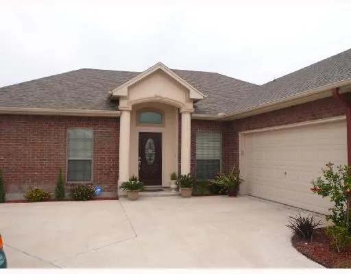 a front view of a house with yard
