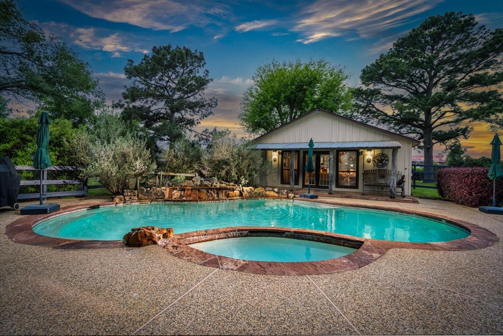 18107 West Cypress Hill Circle Cypress, TX 77433 - Photo 1 of 41 a view of a swimming pool with sitting area
