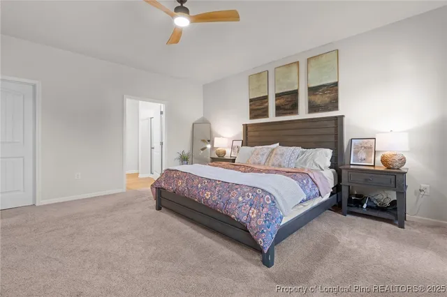 a bedroom with a bed lamp and window