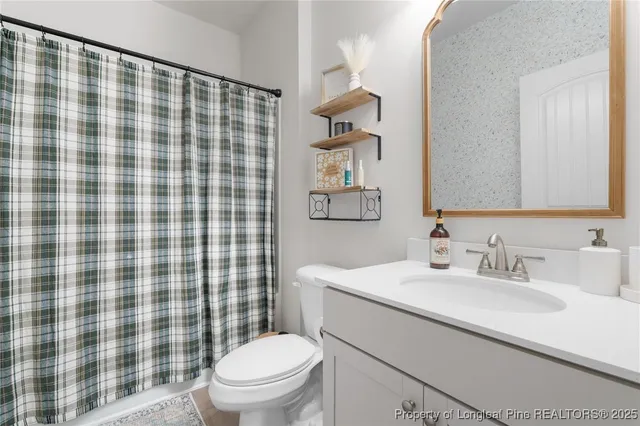 an aerial view of a house with outdoor space