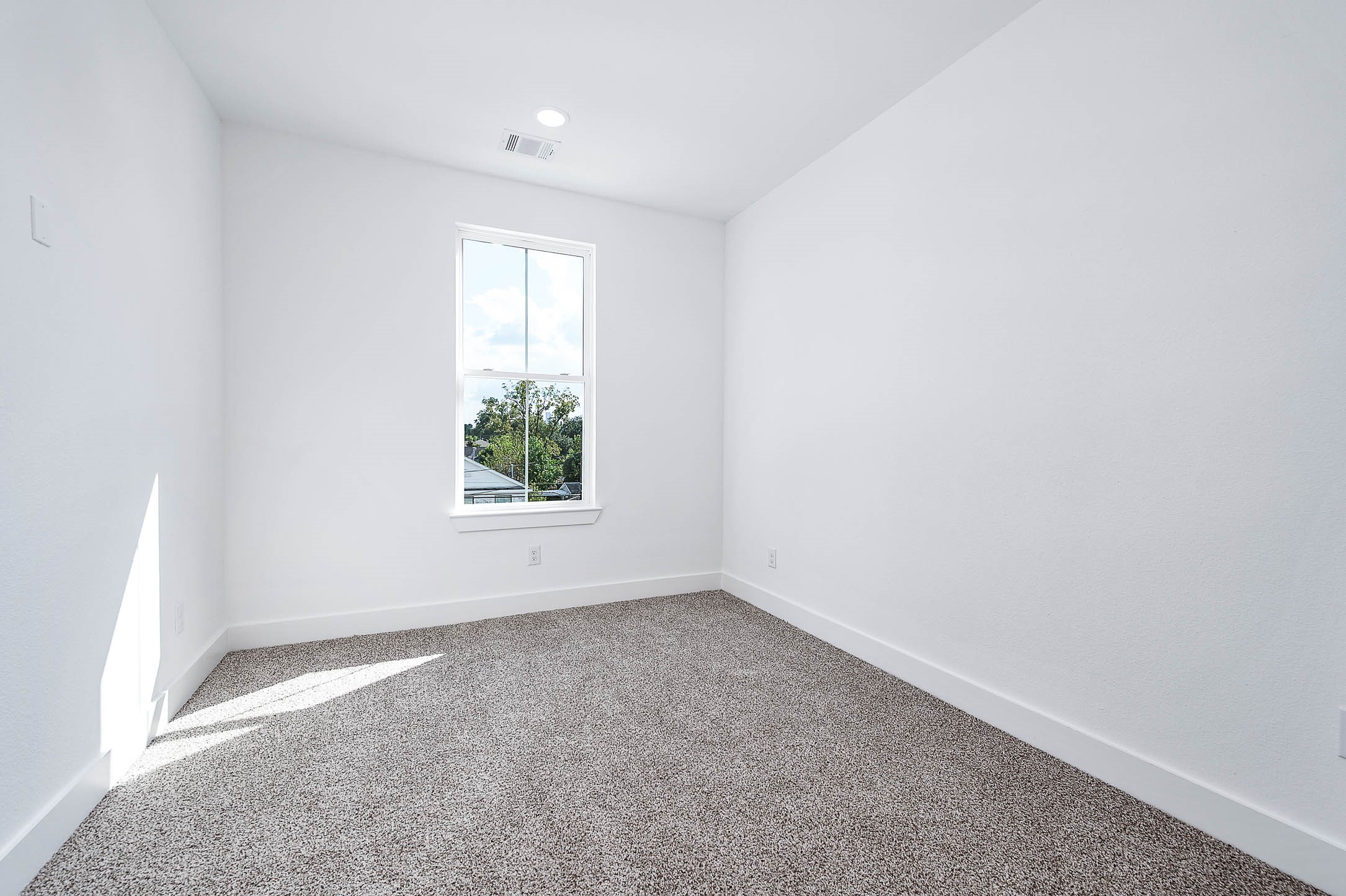 1515 Euel Street Houston, TX 77009 - Photo 21 of 34 Bright and comfortable bedroom featuring soft natural light and a peaceful atmosphere.