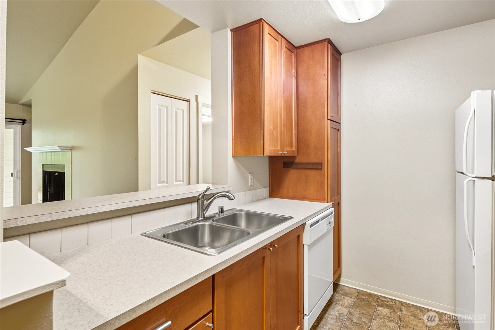 12303 Harbour Pointe Boulevard, Unit Z207 Mukilteo, WA 98275 - Photo 12 of 35 a kitchen with a sink cabinets and a window