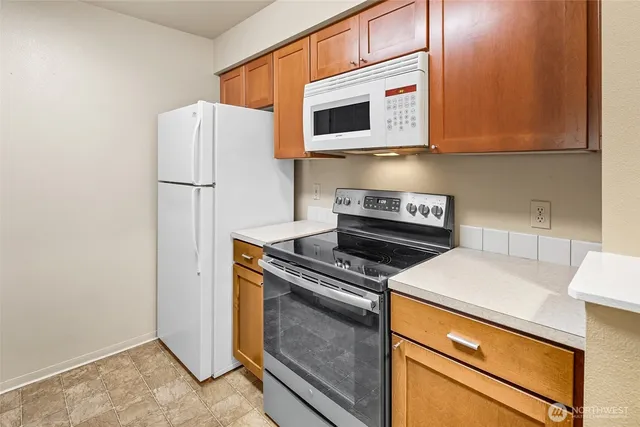 a kitchen with a stove and a microwave