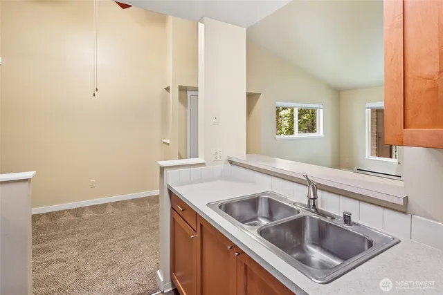 a close view of a sink and a window in a bathroom