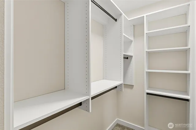 a view of an empty walk in closet