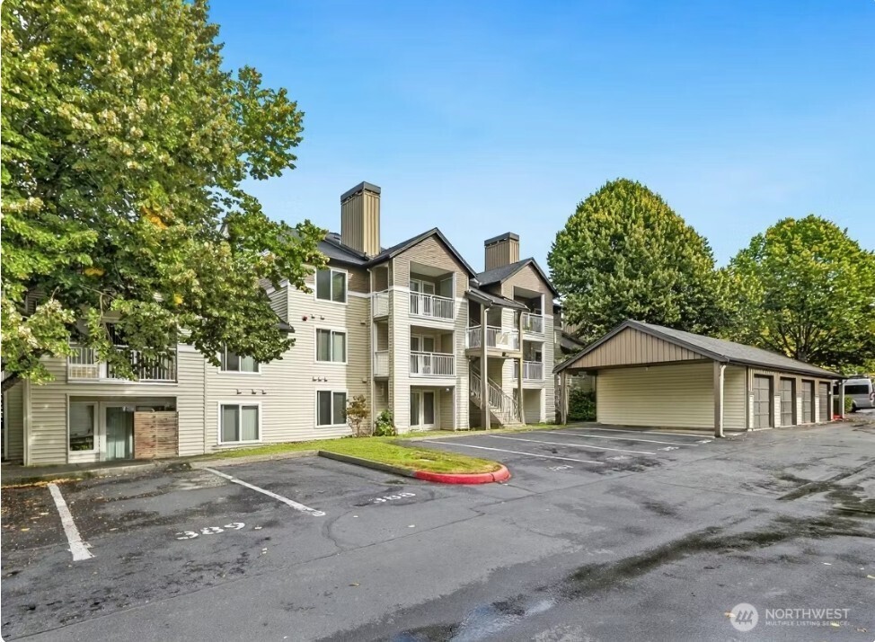 12303 Harbour Pointe Boulevard, Unit Z207 Mukilteo, WA 98275 - Photo 2 of 35 a front view of a house with a yard