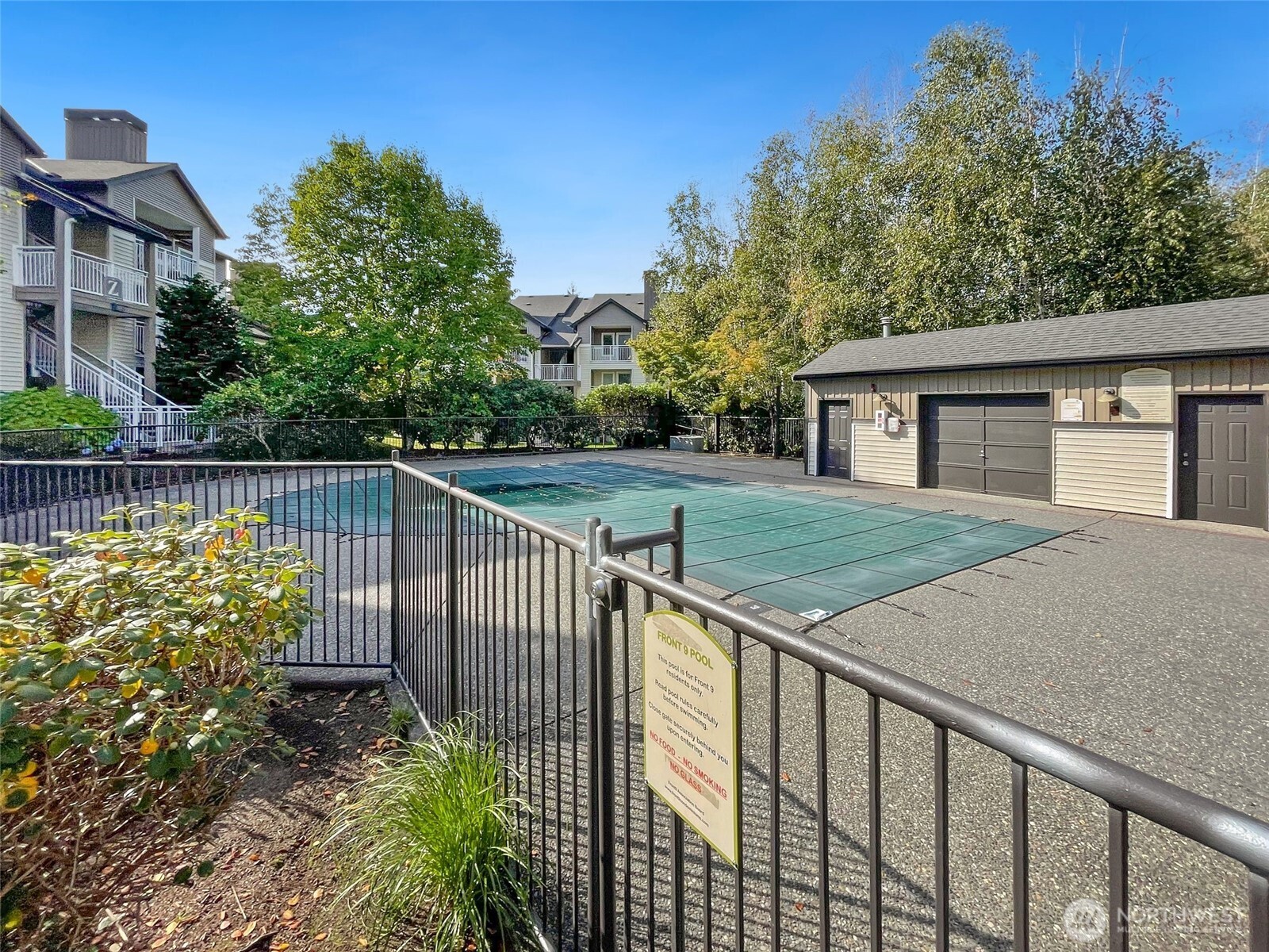 12303 Harbour Pointe Boulevard, Unit Z207 Mukilteo, WA 98275 - Photo 34 of 35 a view of a house with a wooden fence