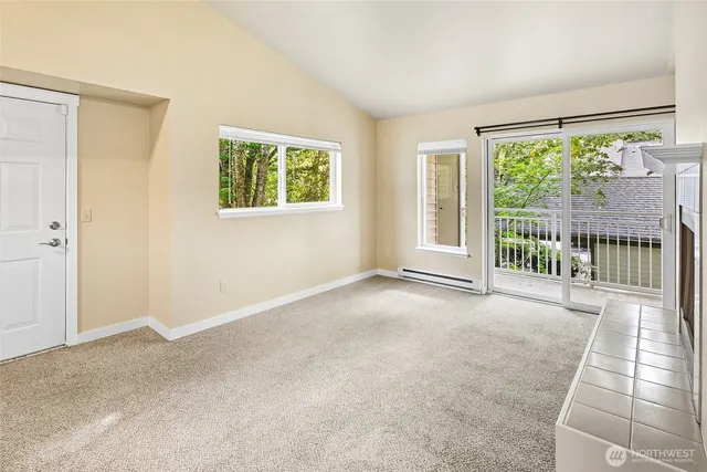 a view of an empty room with a balcony