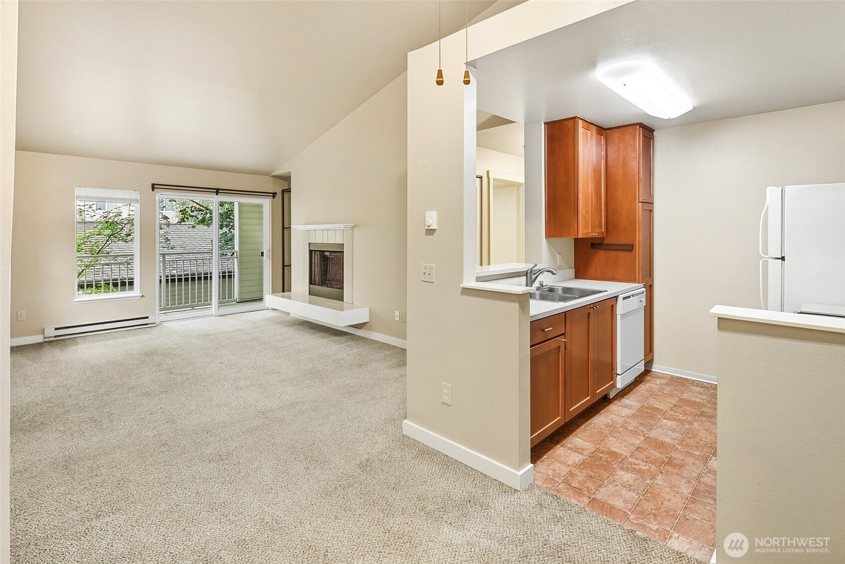 12303 Harbour Pointe Boulevard, Unit Z207 Mukilteo, WA 98275 - Photo 8 of 35 a view of kitchen with windows and refrigerator