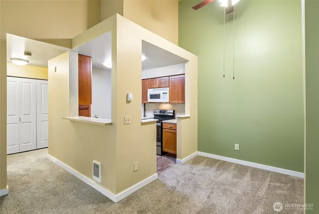 a view of a kitchen cabinets and a utility room