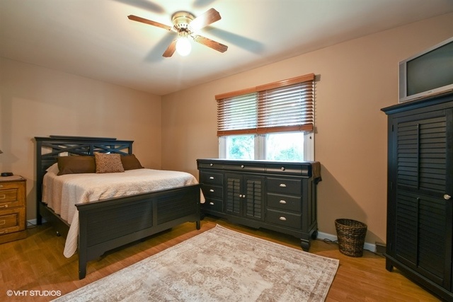 25125 South Rondorey Road Elwood, IL 60421 - Photo 14 of 45 a bedroom with a bed and a tv