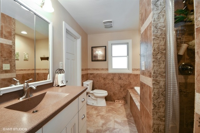 25125 South Rondorey Road Elwood, IL 60421 - Photo 15 of 45 a bathroom with a sink and a mirror