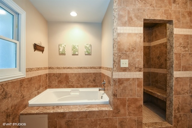 25125 South Rondorey Road Elwood, IL 60421 - Photo 16 of 45 a bath tub sitting next to a shower