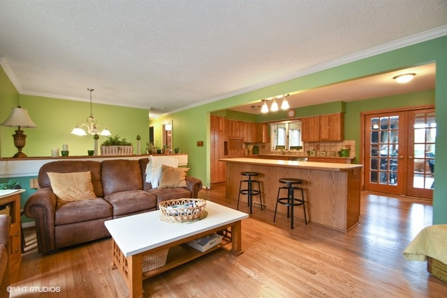 25125 South Rondorey Road Elwood, IL 60421 - Photo 7 of 45 a living room with furniture and kitchen view