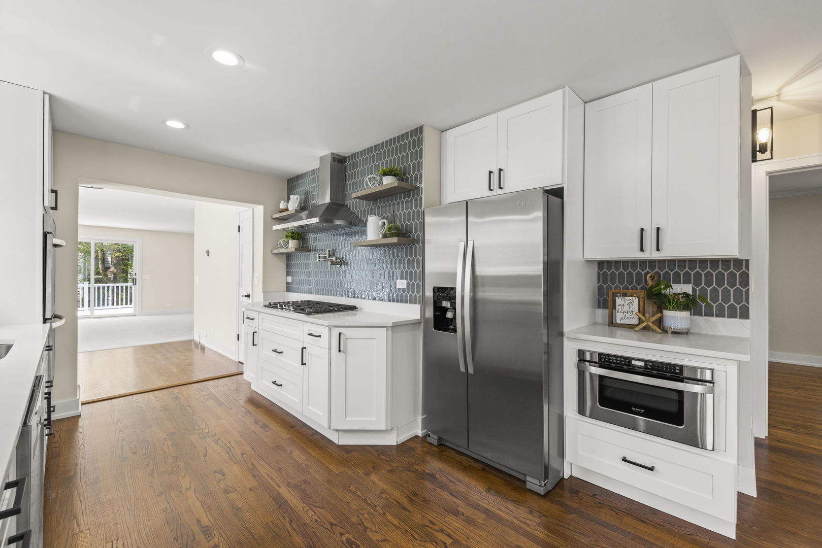 5706 Wolf Road Western Springs, IL 60558 - Photo 11 of 42 a kitchen with stainless steel appliances a refrigerator sink and stove