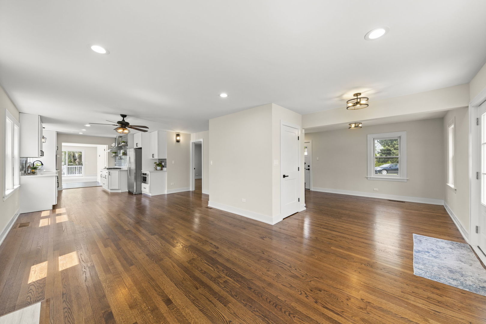 5706 Wolf Road Western Springs, IL 60558 - Photo 6 of 42 wooden floor in an empty room with a window