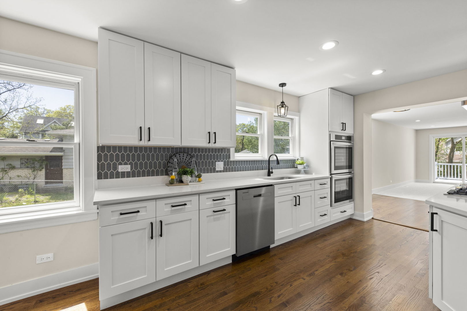 5706 Wolf Road Western Springs, IL 60558 - Photo 10 of 42 a kitchen with granite countertop white cabinets and white appliances