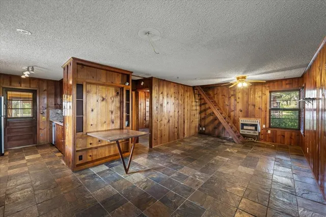 a view of a room with gym equipment and a large window