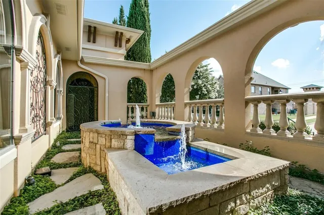 a view of a dining room with furniture a chandelier and wooden floor