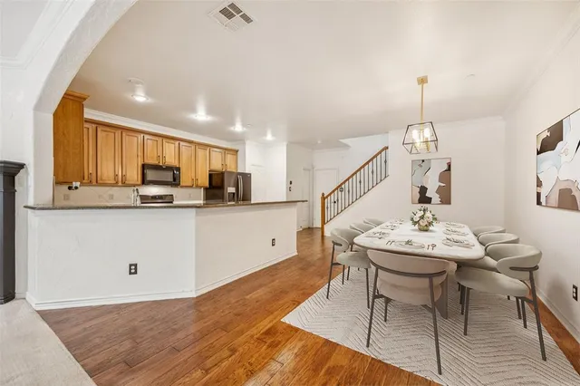 a living room with stainless steel appliances kitchen island granite countertop furniture and a kitchen view
