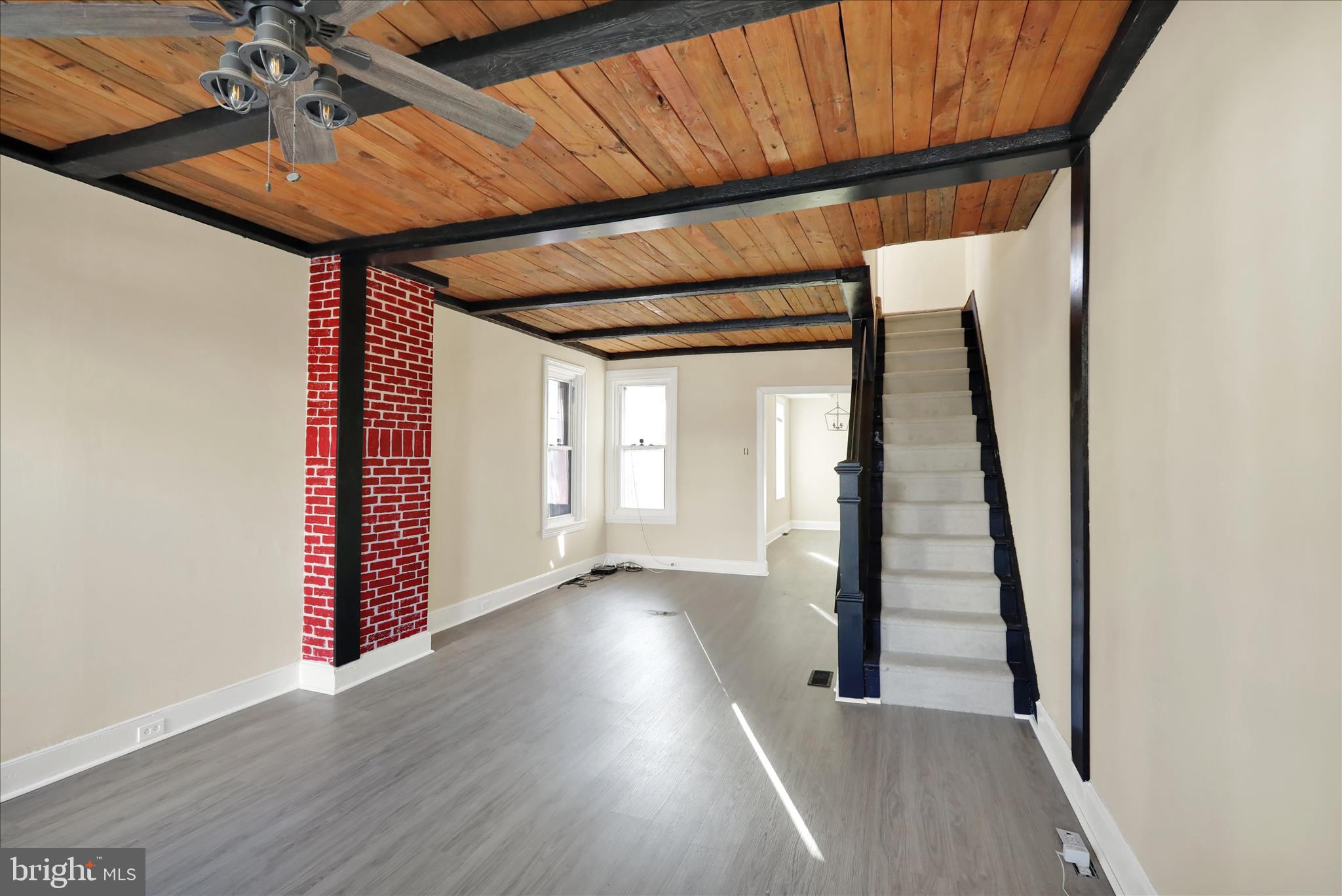 832 Houston Street Columbia, PA 17512 - Photo 4 of 24 a view of a hallway with wooden floor and stairs