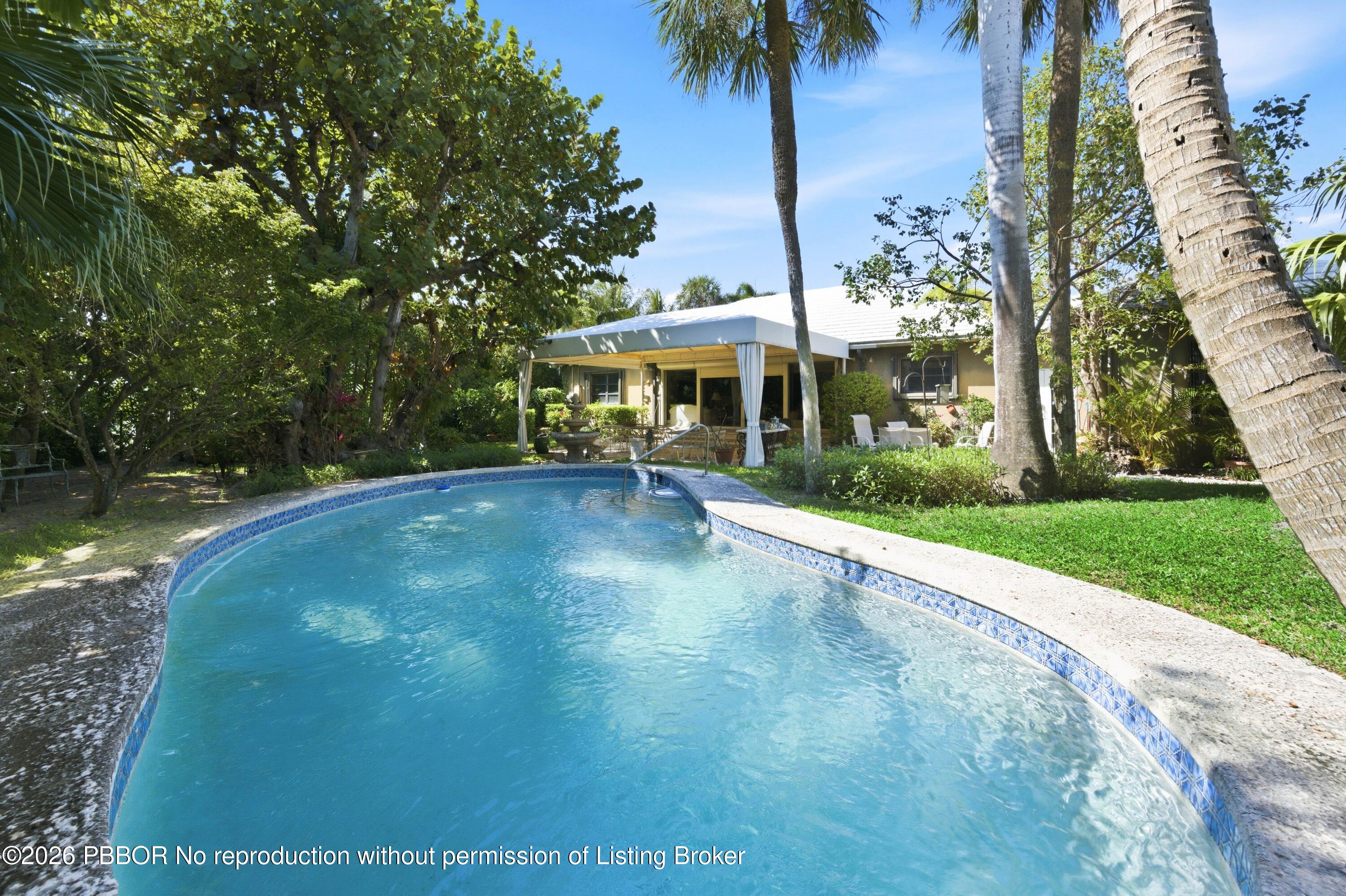 112 Algoma Road Palm Beach, FL 33480 - Photo 3 of 4 a view of a house with a yard