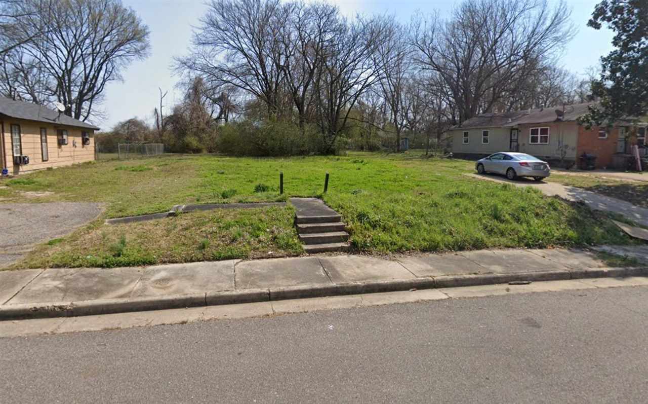 3068 Parker Road Memphis, TN 38109 - Photo 1 of 1 a front view of a house with a yard and garage