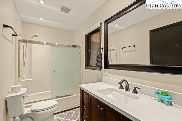 a view of a chairs and table on the deck