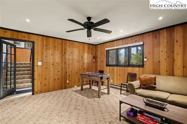 a view of balcony with wooden floor and fence