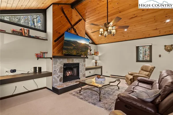 a kitchen with stainless steel appliances granite countertop a stove top oven a sink dishwasher a refrigerator and cabinets with wooden floor