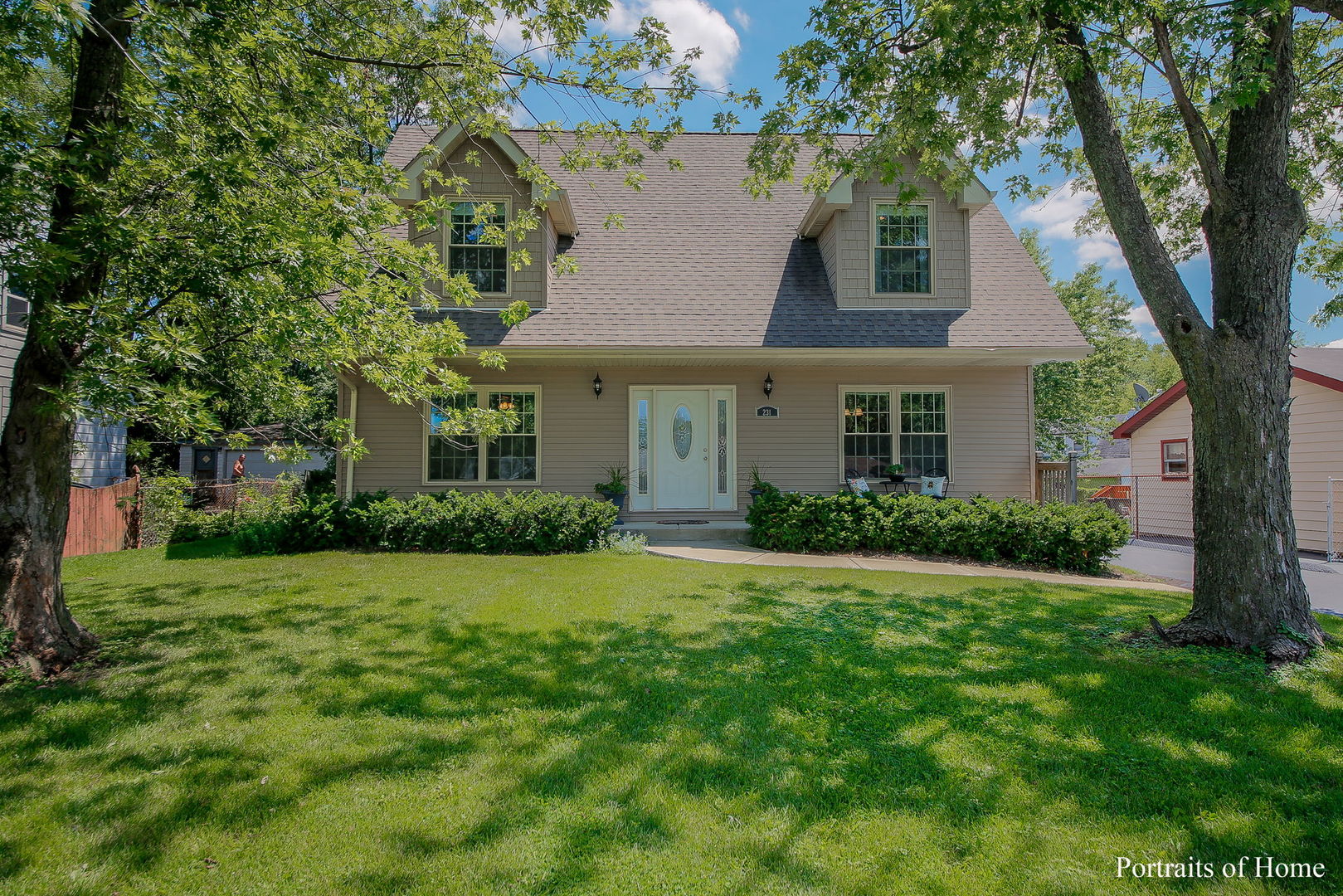 a front view of a house with a yard