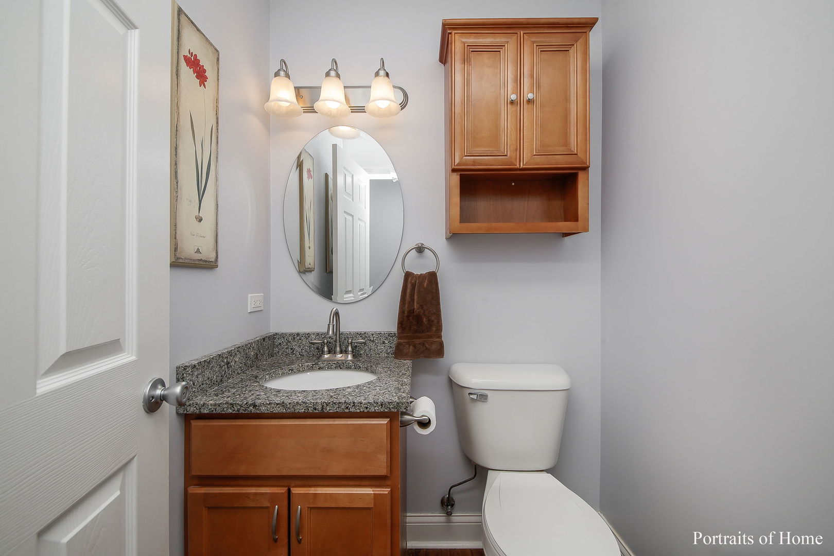 231 Highland Road Willowbrook, IL 60527 - Photo 11 of 38 a bathroom with a toilet sink and mirror